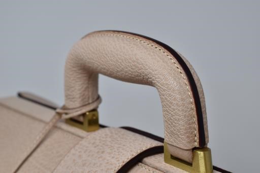 Goatskin Leather Bag with Magnolia Carving, copyright © Takeshi Yonezawa