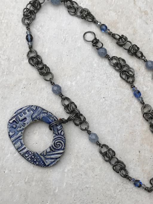 Blue Rustic Necklace with Iridescent Czech Beads and Hematite Accents, copyright © Angela Brasser